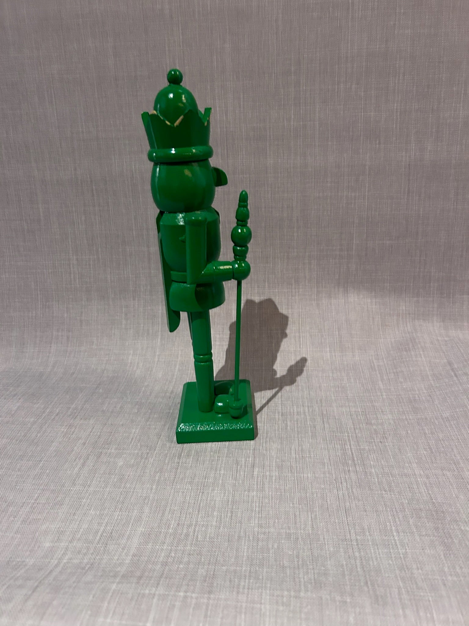 Vintage Monochrome Green Hand-Carved Wooden Nutcracker Guard with Crown and Staff, Folk Art Decorative Figure