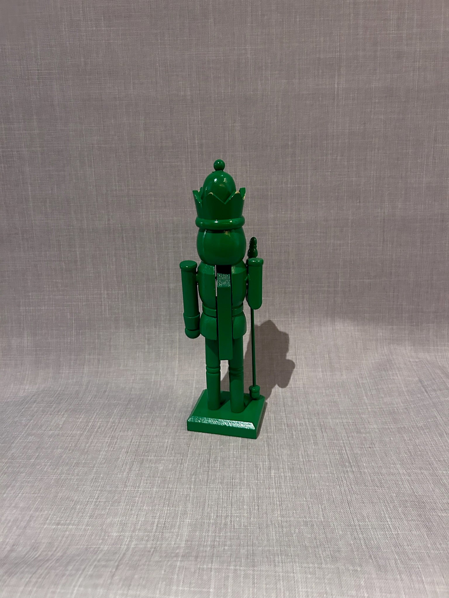 Vintage Monochrome Green Hand-Carved Wooden Nutcracker Guard with Crown and Staff, Folk Art Decorative Figure