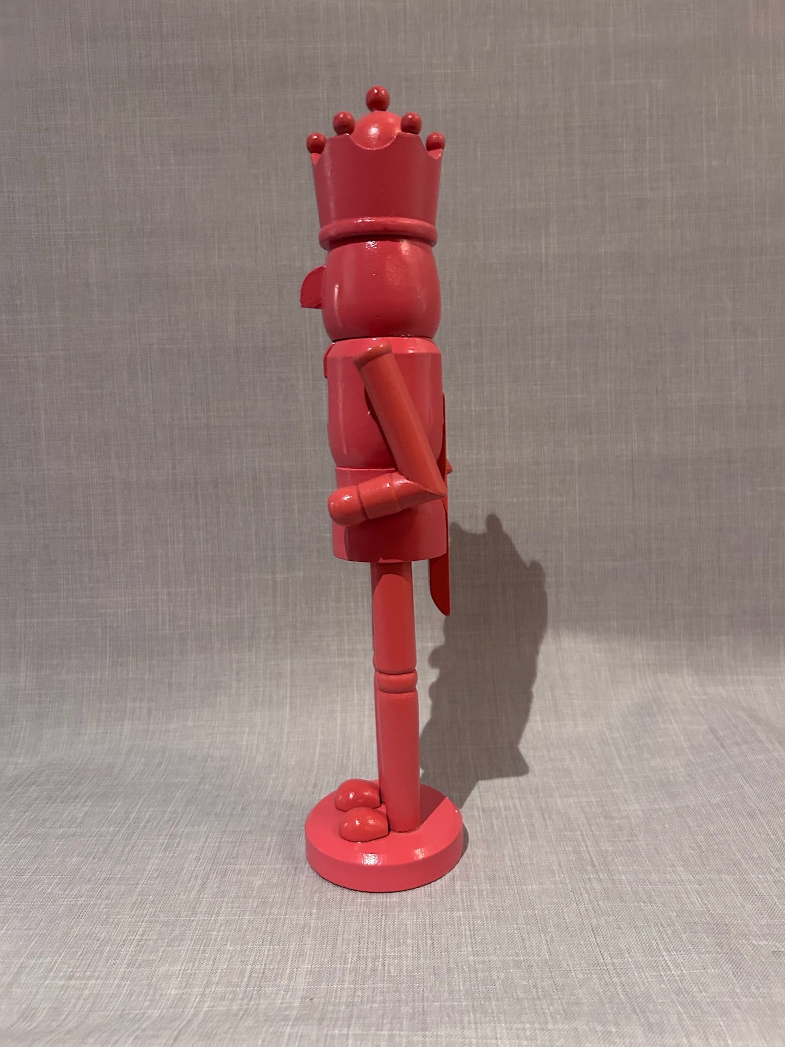 Vintage Hand-Painted Wooden Nutcracker King Sculpture in Coral Pink, Folk Art Decorative Figure