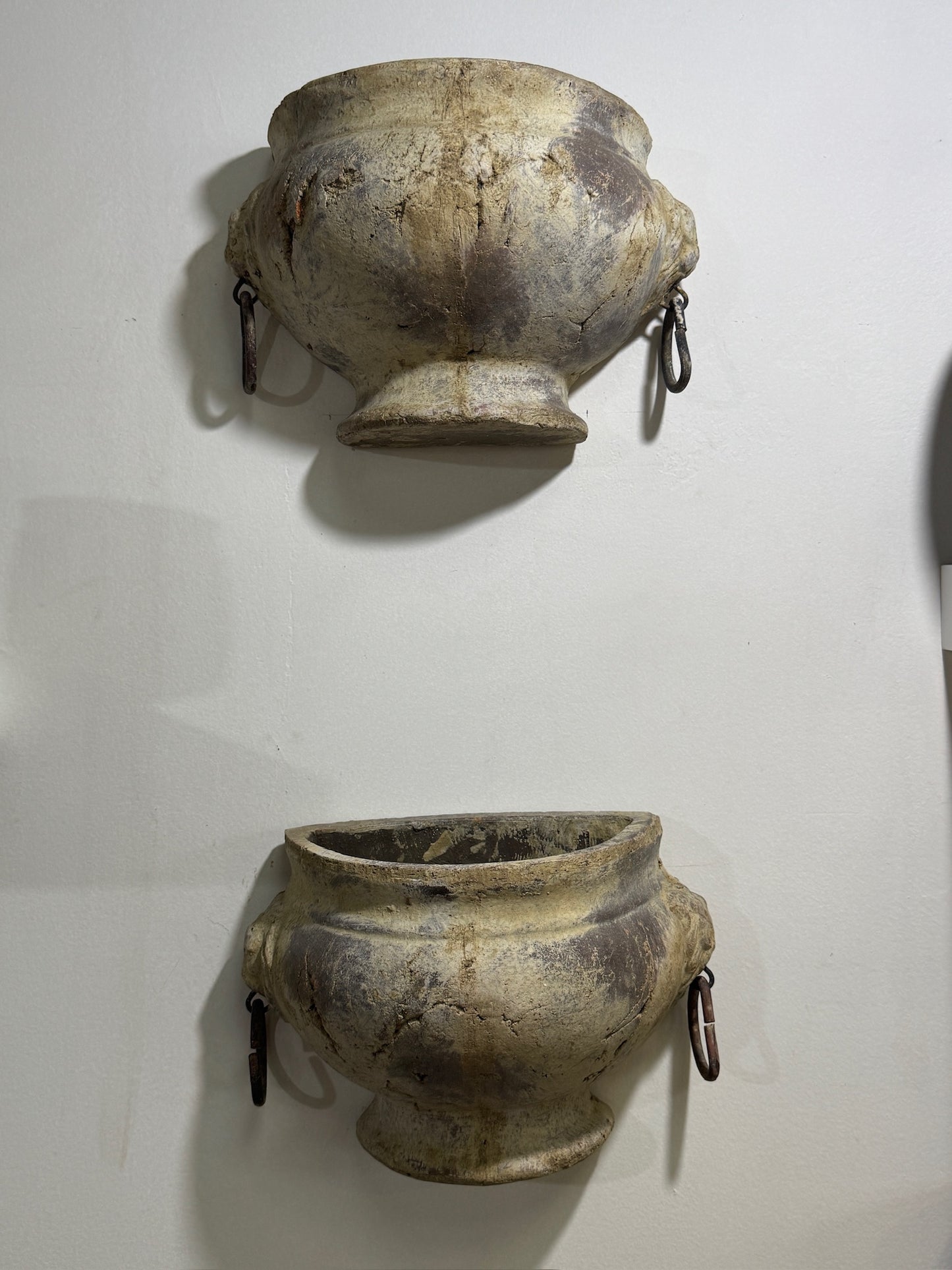 Pair of Aged Mediterranean-Style Wall Planters with Iron Ring Handles – Rustic Half-Moon Pottery Vessels