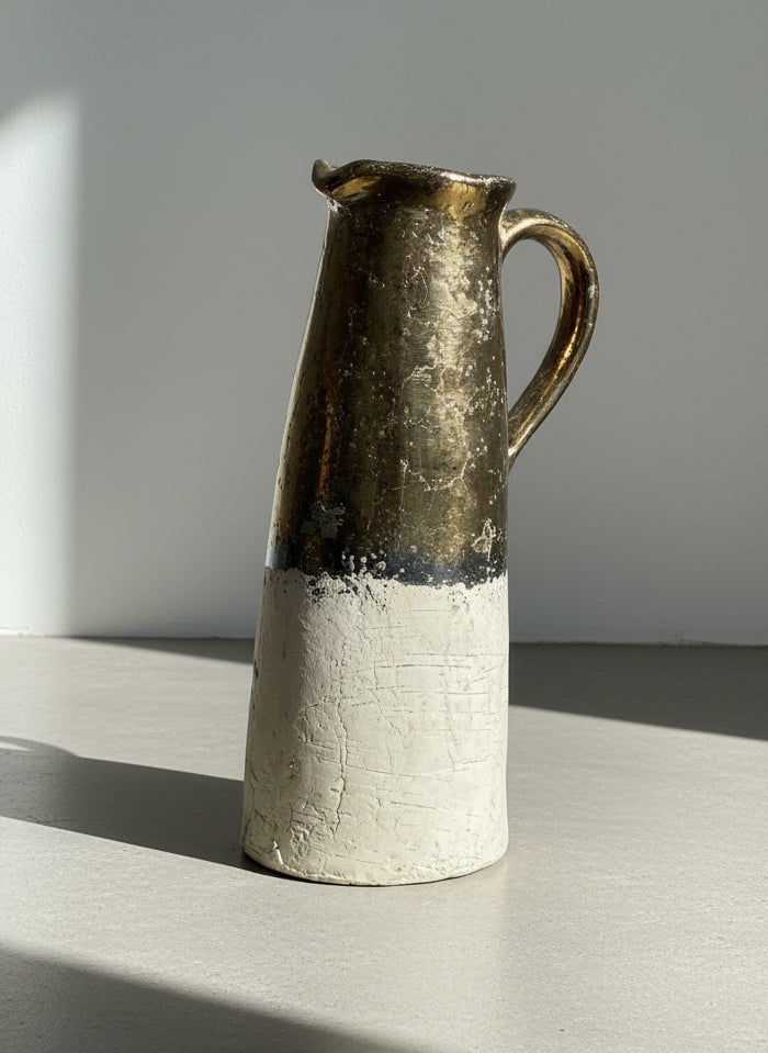 large terracotta pitcher with half gold glaze and textured white body
