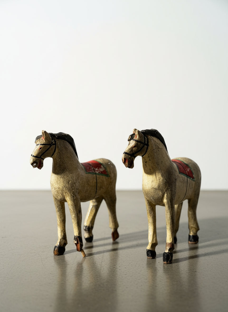 Pair of Vintage Hand-Carved Wooden Folk Art Horses with Aged Painted Saddles