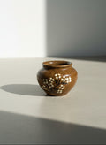 rustic stoneware jar with floral design handmade ceramic decor