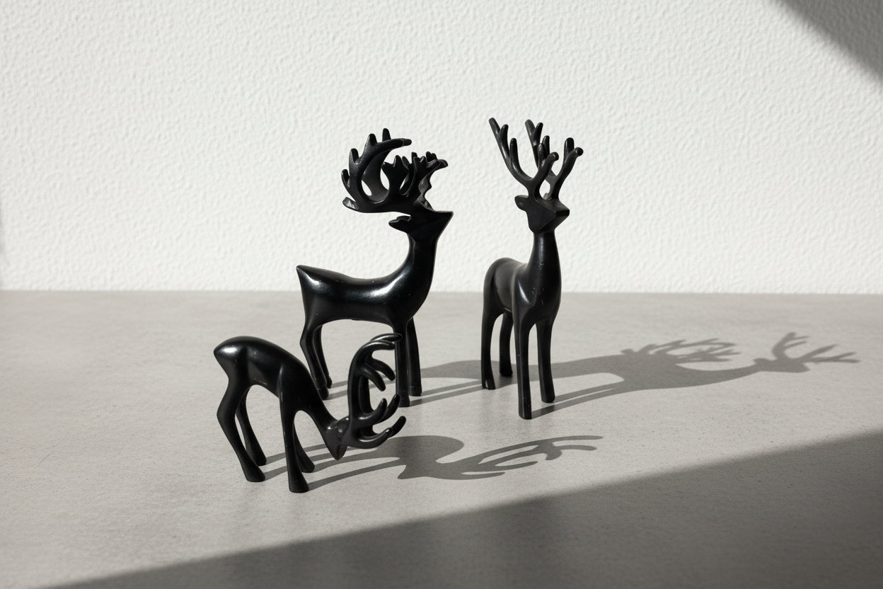 Set of Three Sculptural Black Deer Figures, Mid-Century Modern Scandinavian-Inspired Decorative Objects