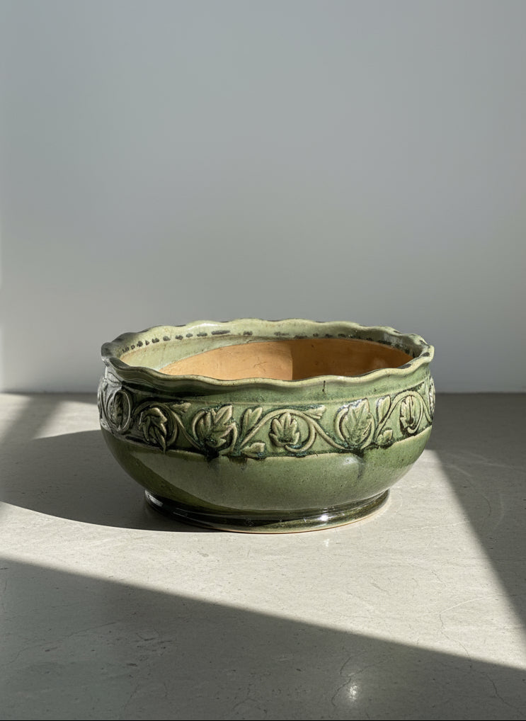 large green glazed ceramic bowl with embossed leaf motif