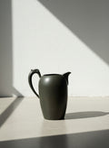 Vintage Black Ceramic Pitcher with Sculpted Scroll Handle – Matte Handcrafted Art Pottery Vessel