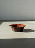antique style dark red earthenware bowl with scalloped rim