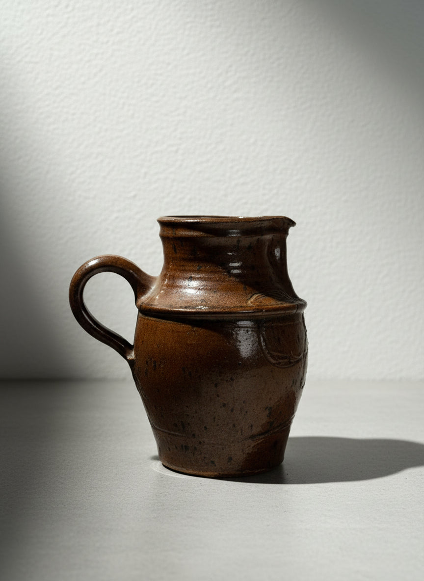 Handmade Rustic Brown Glazed Stoneware Pitcher with Carved Folk Art Motifs
