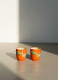 vintage Japanese orange ceramic mini cups set of 2