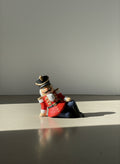 Whimsical Hand-Painted Reclining Nutcracker Soldier Holiday Figurine