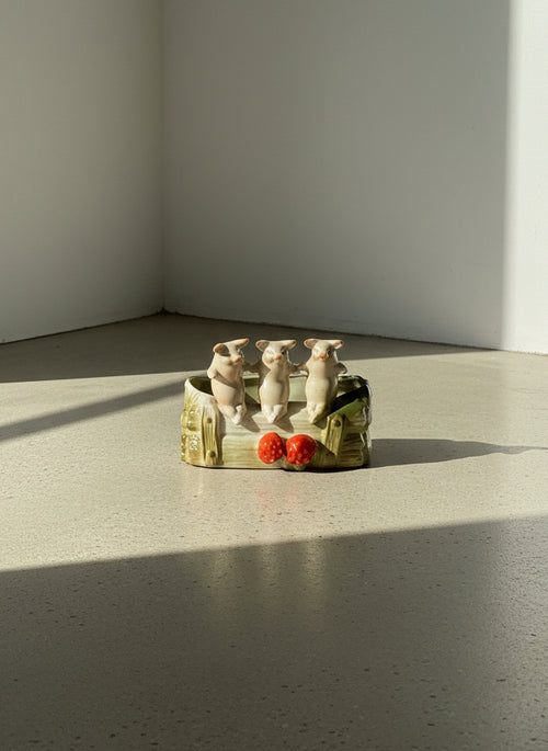 vintage ceramic pig planter with log design and strawberry accents