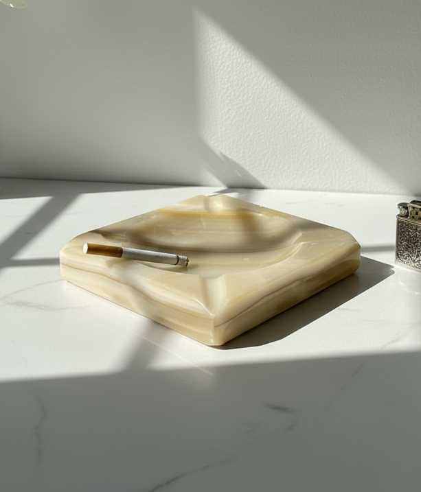 1960s cream-coloured stone ashtray with clean geometric lines, four cigarette rests, and polished finish, a timeless mid-century collectible — Hommes and Gardens, Smoke + Fire Collection, Decorative Objects, Landscape Architect, Interior Designer, Outdoor Living, Outdoor Decorations, Home Design, Luxury Design, Art, Furniture, Objects, Best Gifts, Nature, Backyard, Yard.