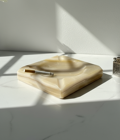 1960s cream-coloured stone ashtray with clean geometric lines, four cigarette rests, and polished finish, a timeless mid-century collectible — Hommes and Gardens, Smoke + Fire Collection, Decorative Objects, Landscape Architect, Interior Designer, Outdoor Living, Outdoor Decorations, Home Design, Luxury Design, Art, Furniture, Objects, Best Gifts, Nature, Backyard, Yard.