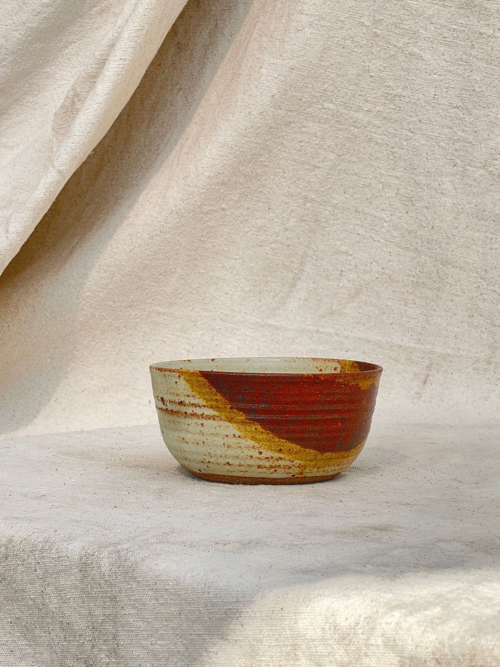 handmade rust glazed ceramic bowl with signature base vintage decor