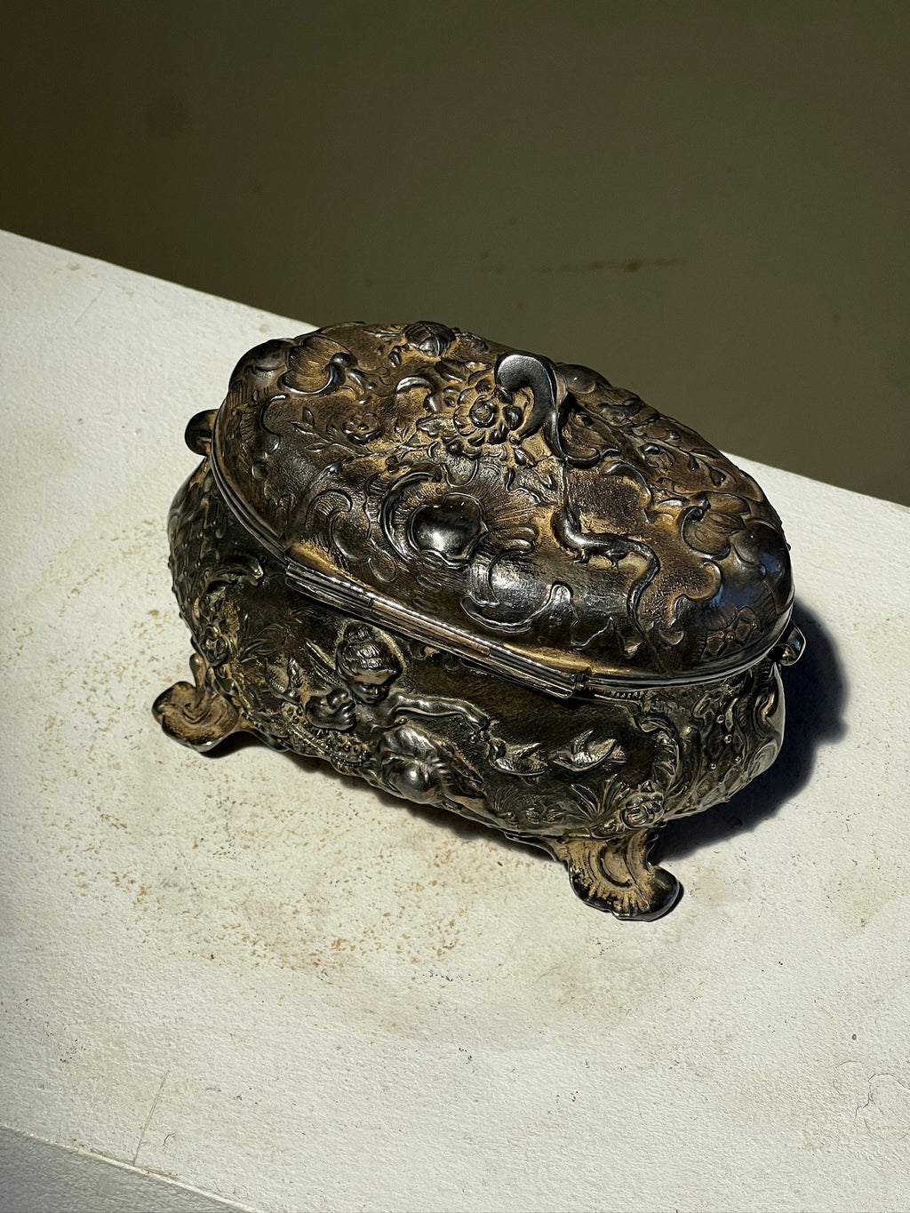 19th century French decorative metal jewelry box featuring cherub engraving and intricate relief work, embodying classic European design — Hommes and Gardens, Objects Collection, Landscape Architect, Interior Designer, Outdoor Living, Art, Furniture, Objects, Best Gifts, Nature, Backyard, Yard, Outdoor Decorations, Home Decor, Home Design, Luxury Design.