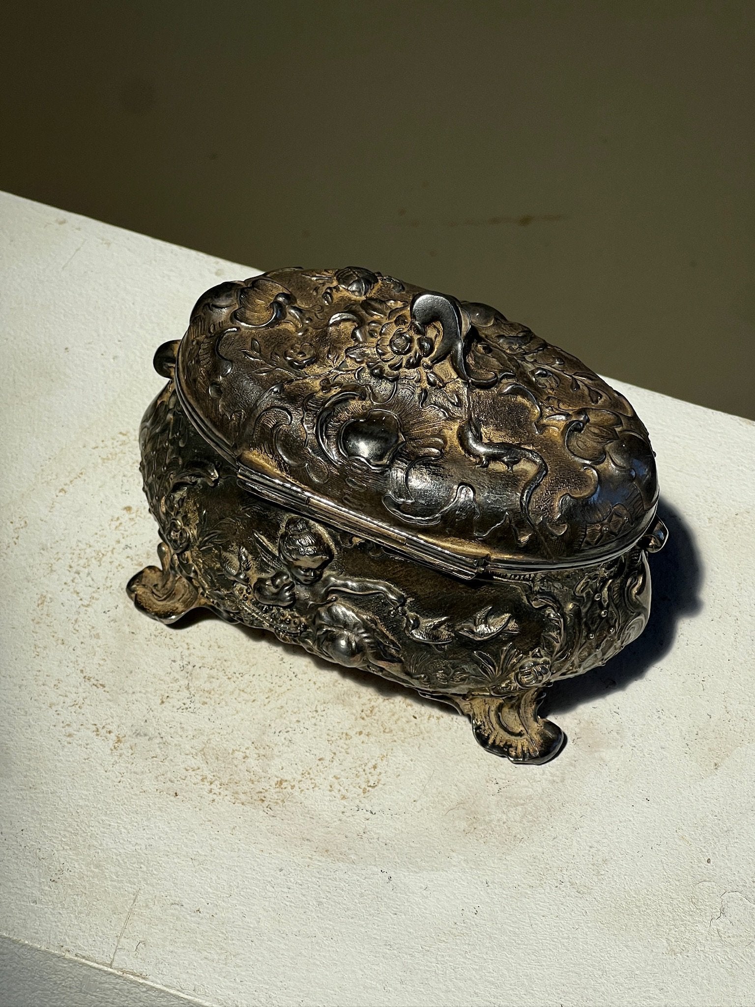 19th century French decorative metal jewelry box featuring cherub engraving and intricate relief work, embodying classic European design — Hommes and Gardens, Objects Collection, Landscape Architect, Interior Designer, Outdoor Living, Art, Furniture, Objects, Best Gifts, Nature, Backyard, Yard, Outdoor Decorations, Home Decor, Home Design, Luxury Design.