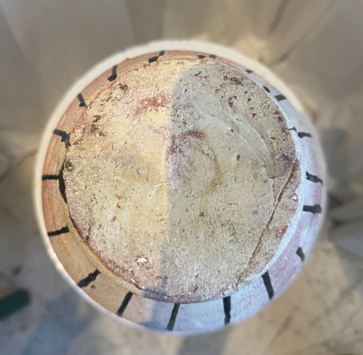 Vintage Glazed Terracotta Amphora Vase with Drip Glaze Detailing top view highlighting earthy textures. hommes + gardens estudio.