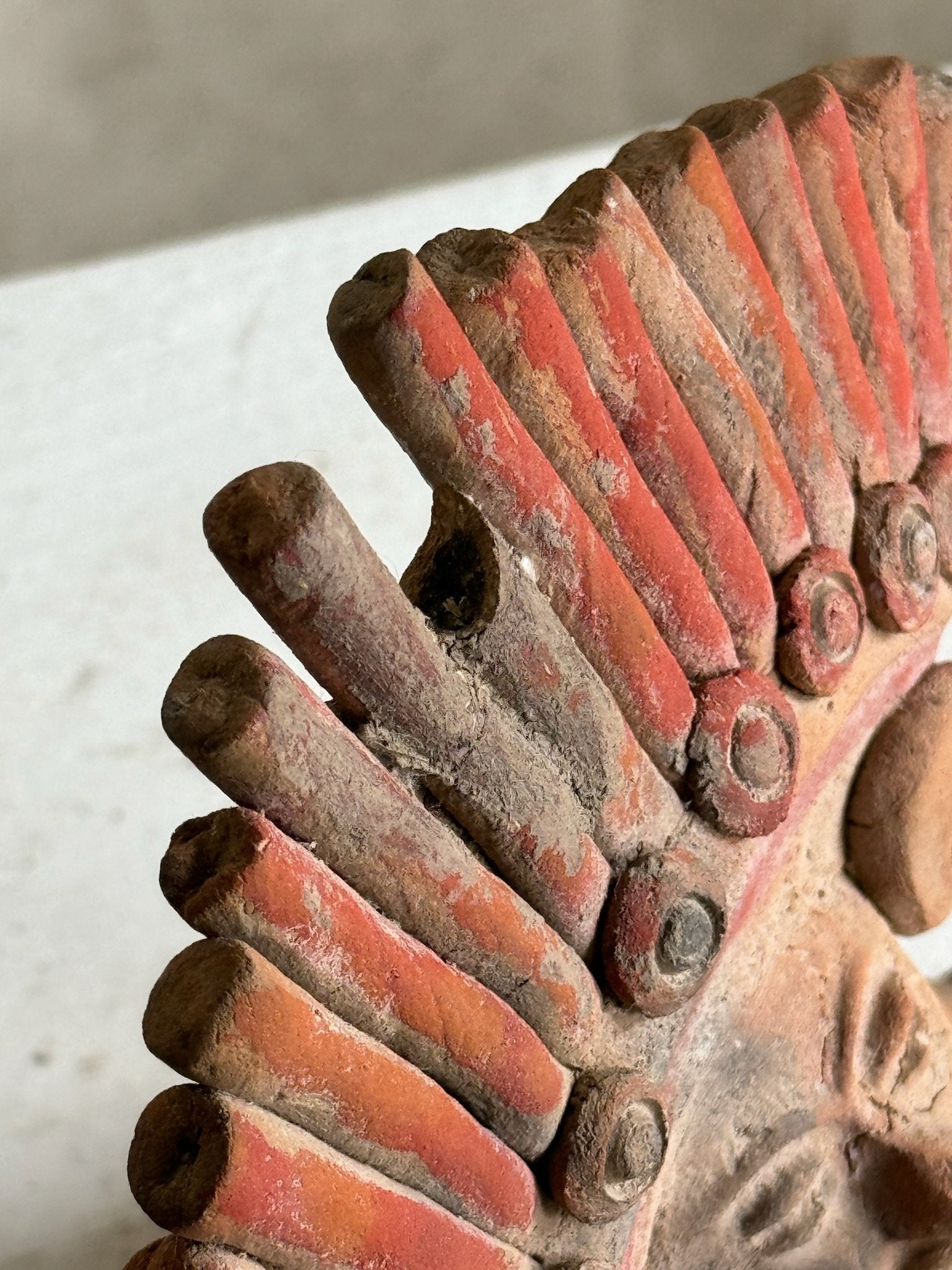 Vintage Aztec Mayan Tribal Figure close-up showing intricate terracotta details and colors, hommes + gardens estudio.