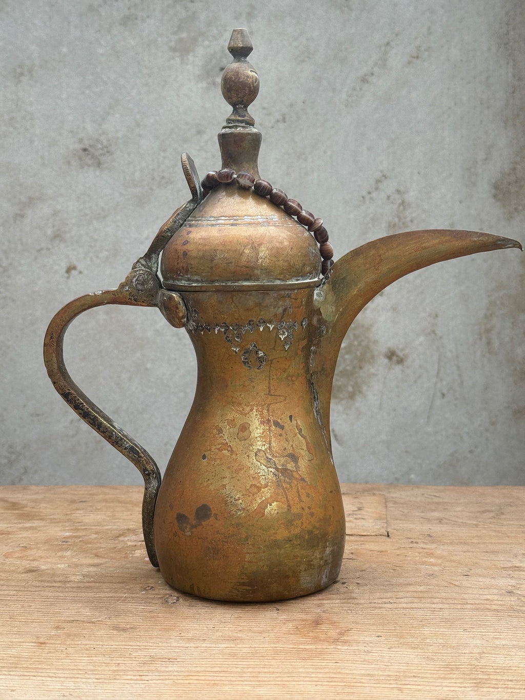 Antique Arabic Dallah brass coffee pot with beautiful patina and traditional Bedouin design, symbol of hospitality and craftsmanship — Hommes and Gardens, Objects Collection, Landscape Architect, Interior Designer, Outdoor Living, Art, Furniture, Objects, Best Gifts, Nature, Backyard, Yard, Outdoor Decorations, Home Decor, Home Design, Luxury Design.