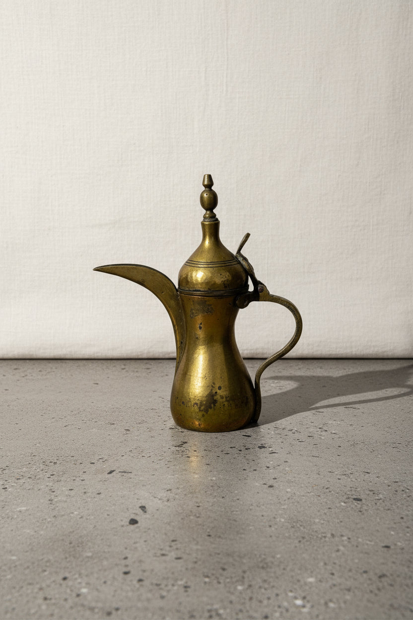 Antique Middle Eastern Arabic dallah coffee pot crafted from brass with intricate bronze detailing, showcasing traditional artistry and elegant spout design — Hommes and Gardens, Objects Collection, Decorative Home Decor, Landscape Architect, Interior Designer, Outdoor Living, Outdoor Decorations, Home Design, Luxury Design, Art, Furniture, Objects, Best Gifts, Nature, Backyard, Yard.