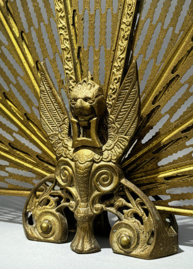 Antique Brass Griffin & Peacock Folding Fire Guard – Edwardian Fireplace c.1900s with intricate sunburst design and central griffin. hommes + gardens estudio.