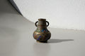 Antique cloisonné-inlaid brass bud vase with double handles and colorful floral enamel motifs in red, blue, and green, a petite Chinese decorative collectible with aged patina — Hommes and Gardens, Decorative Collection, Home Decor, Landscape Architect, Interior Designer, Outdoor Living, Outdoor Decorations, Home Design, Luxury Design, Art, Furniture, Objects, Best Gifts, Nature, Backyard, Yard.