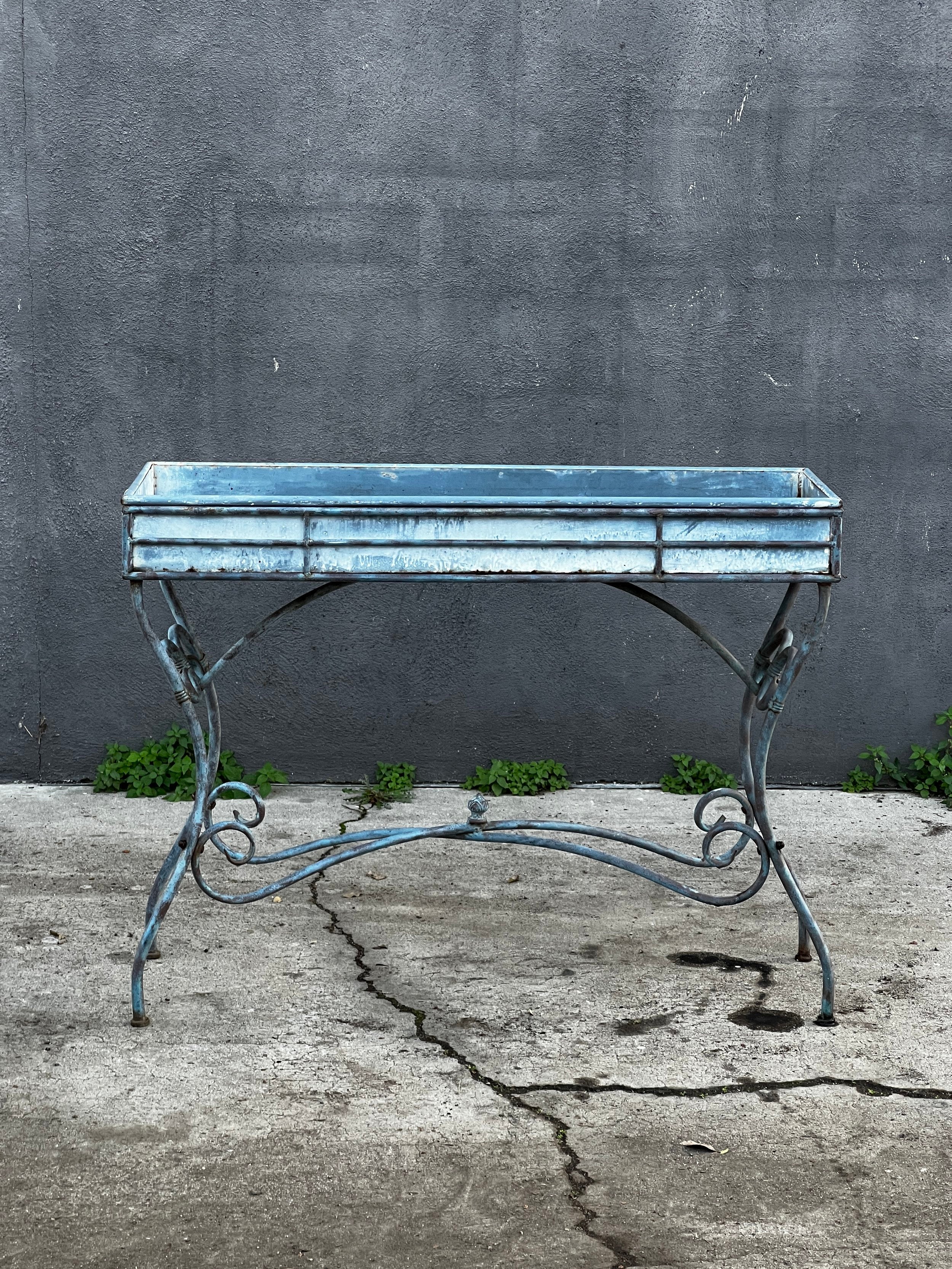 Vintage Arras Style Tall Weathered Metal Plant Stand showcasing vintage elegance in distressed metal finish. hommes + gardens estudio.