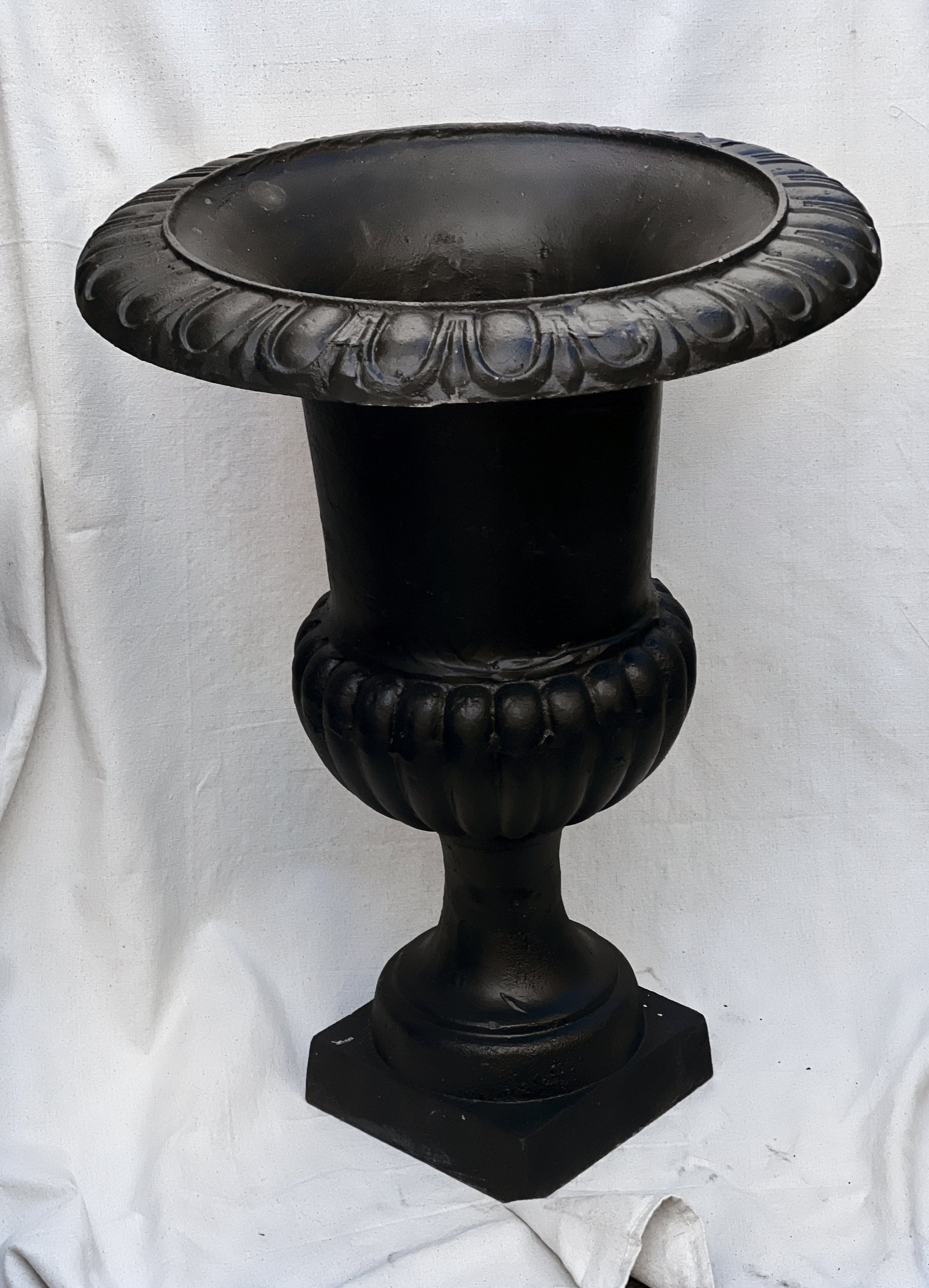 Pair of 29" French Cast Iron Urn Black Planters featuring ornate details and a classic design. hommes + gardens estudio