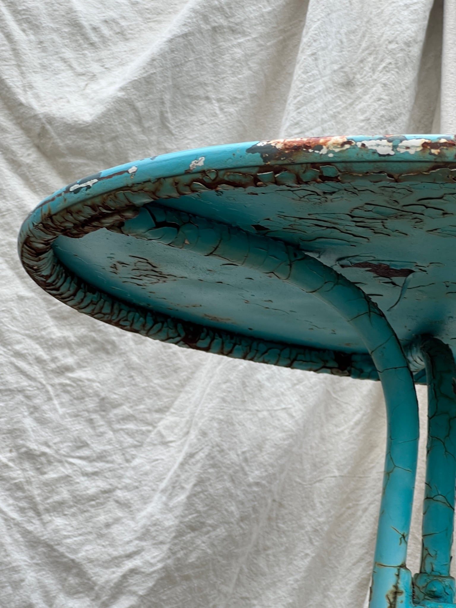 Vintage French Turquoise Rusted Bistro Table with elegant base and distressed paint. Perfect for vintage decor. hommes + gardens estudio.