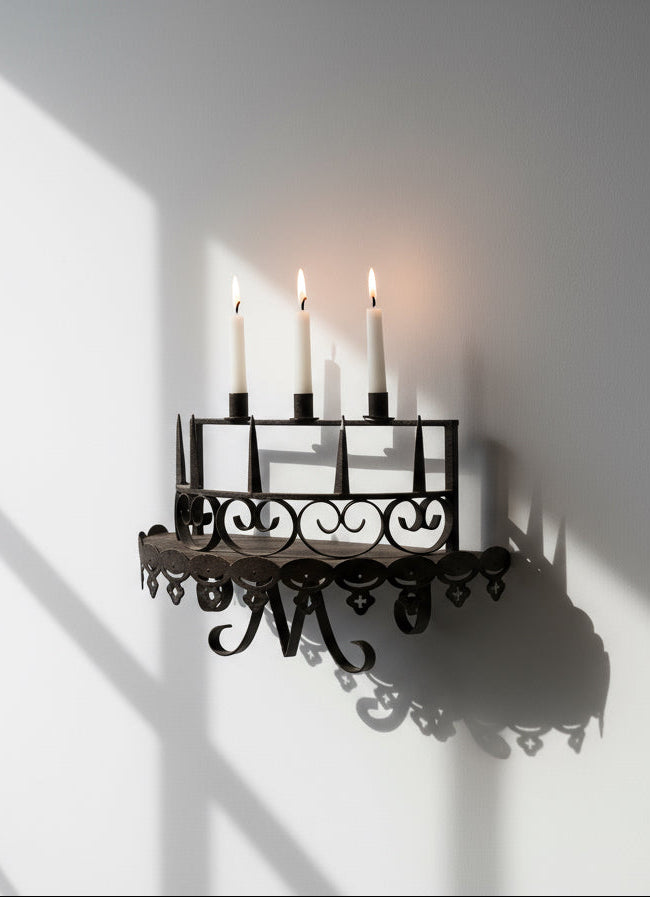 Set of two antique Gothic wrought iron candle wall sconces with intricate medieval patterns, perfect for vintage interiors — Hommes and Gardens, Home Decor Collection, Wallscape, Candles, Antique Ironwork, Decorative Objects, Gothic Style, Historic Design.