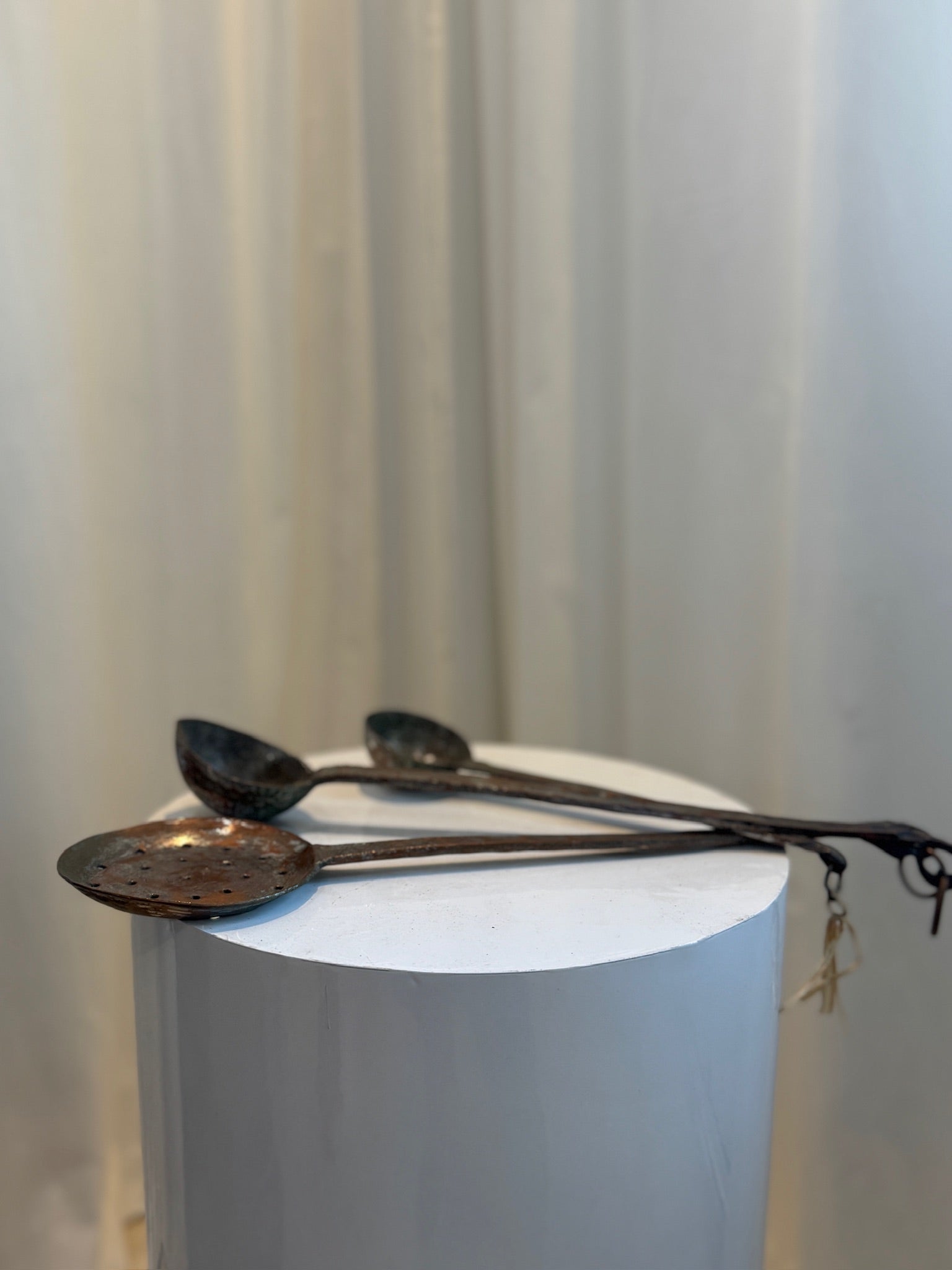 Antique hand-forged iron ladle trio, including perforated skimmer and deep-bowl spoons, showcasing traditional blacksmith metalwork — Hommes and Gardens, Objects Collection, Landscape Architect, Interior Designer, Outdoor Living, Art, Furniture, Objects, Best Gifts, Nature, Backyard, Yard, Outdoor Decorations, Home Decor, Home Design, Luxury Design.