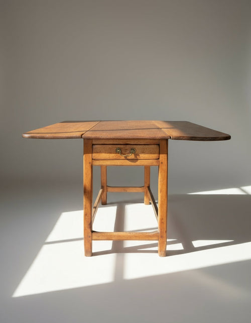 Antique rustic pine dropleaf cottage dining table with aged patina, sturdy square legs, and single drawer storage, a charming farmhouse piece perfect for space-saving interiors — Hommes and Gardens, Furniture Collection, Home Decor, Outdoor Decorations, Landscape Architect, Interior Designer, Outdoor Living, Home Design, Luxury Design, Art, Furniture, Objects, Best Gifts, Nature, Backyard, Yard.