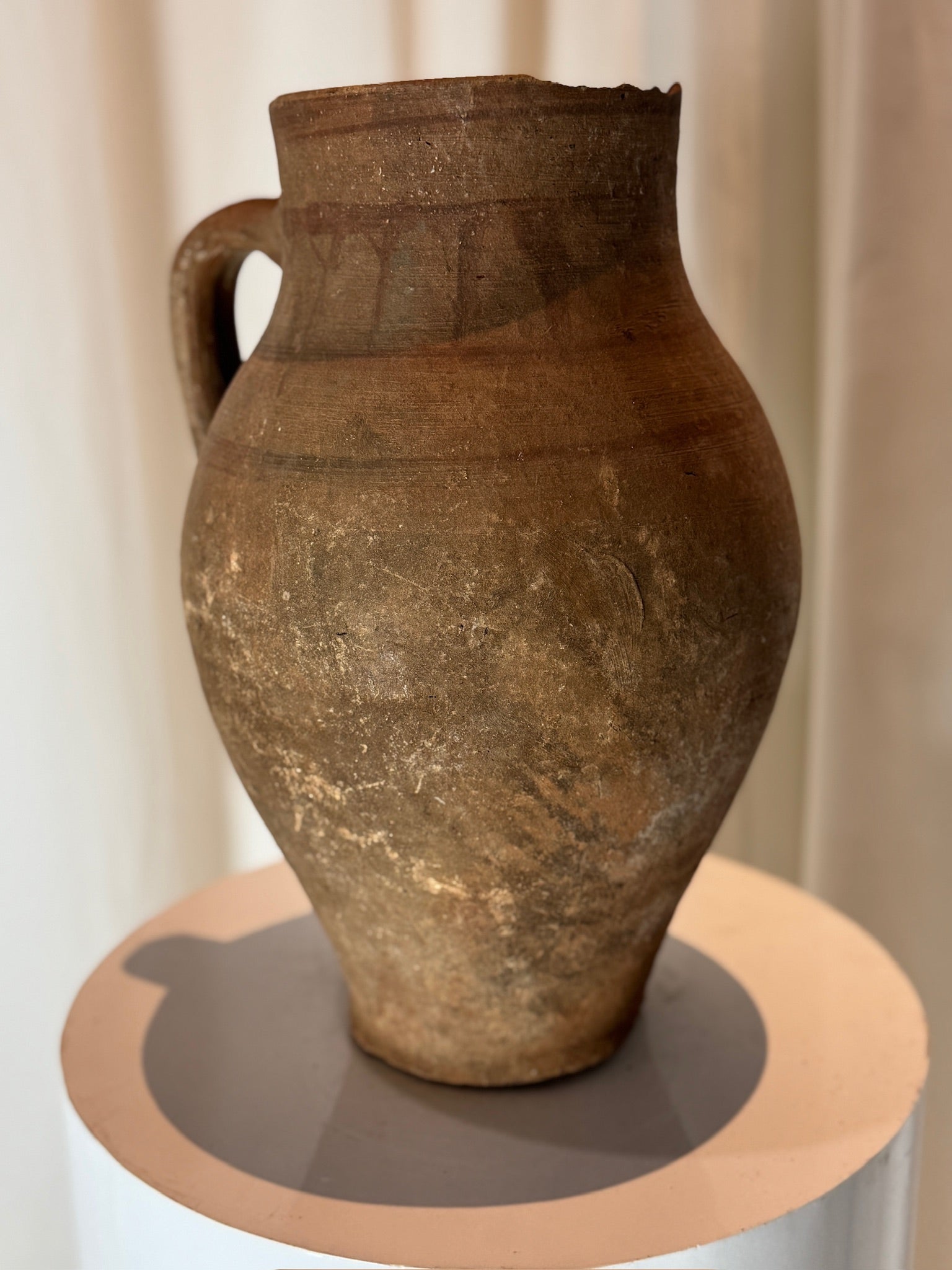 Antique rustic terracotta pottery water jug with sturdy handle and organic form, an earthy collectible adding warmth and history to any décor — Hommes and Gardens, Vases + Vessels Collection, Landscape Architect, Interior Designer, Outdoor Living, Art, Furniture, Objects, Best Gifts, Nature, Backyard, Yard, Outdoor Decorations, Home Decor, Home Design, Luxury Design.