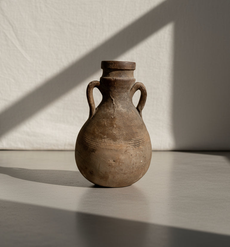 Antique terracotta amphora-style vessel with double handles, rounded body, and aged earthen patina, a handcrafted Roman-inspired pottery piece with timeless classical charm — Hommes and Gardens, Decorative Collection, Home Decor, Landscape Architect, Interior Designer, Outdoor Living, Outdoor Decorations, Home Design, Luxury Design, Art, Furniture, Objects, Best Gifts, Nature, Backyard, Yard.