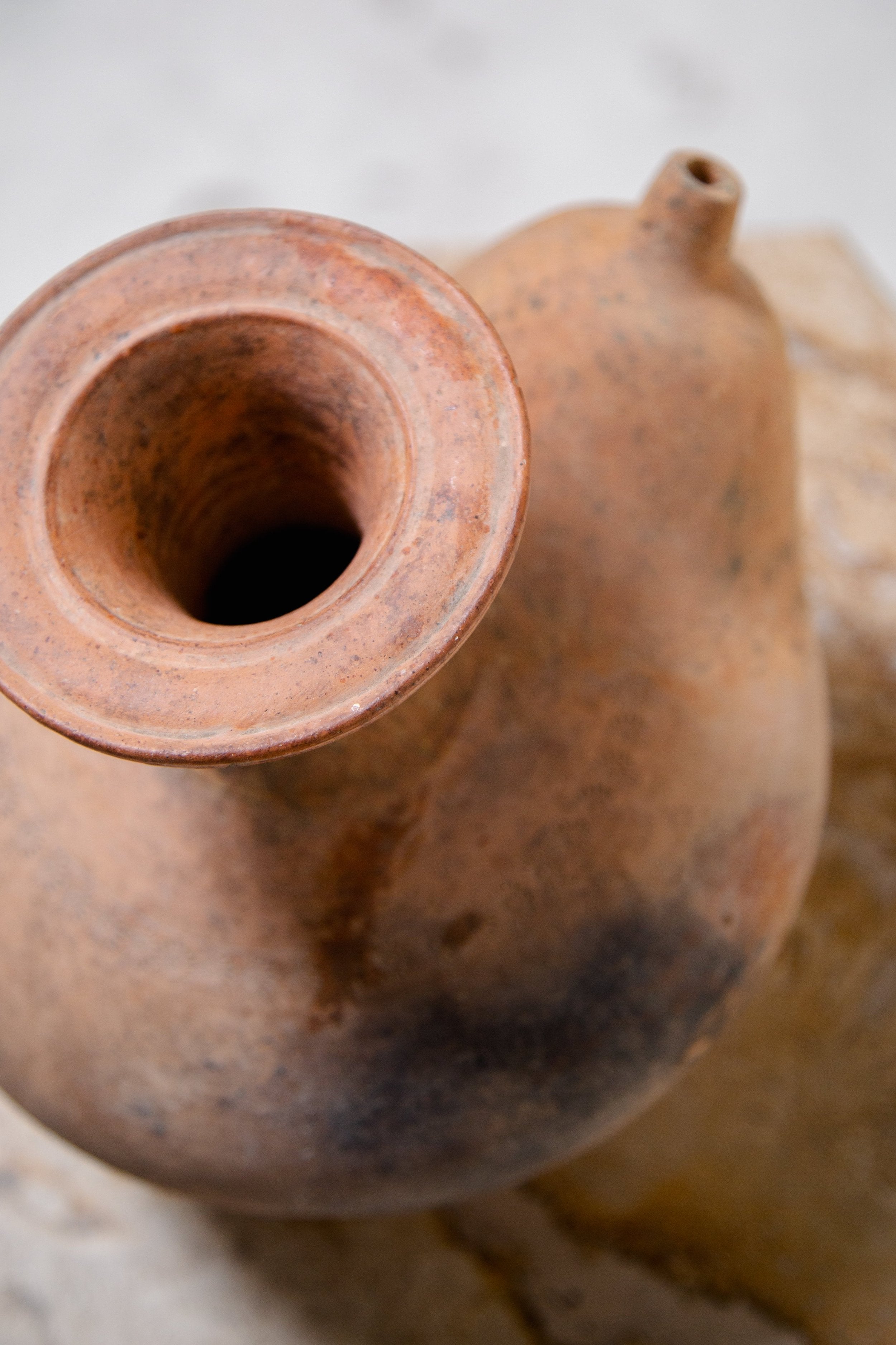 Antique terracotta kendi water vessel from Southeast Asia with rounded form and side spout, rich in cultural heritage — Hommes and Gardens, Objects, Vases + Vessels Collection, home decor, outdoor decorations, home design, luxury design, Landscape Architect, Interior Designer, Outdoor Living, Art, Furniture, Objects, Best Gifts, Nature, Backyard, Yard.