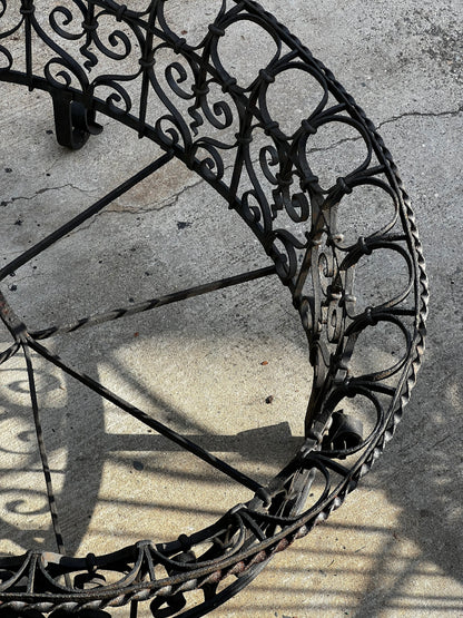 Antique Victorian wrought iron plant holder in oval shape, featuring detailed scrollwork and weathered finish, perfect for classic garden styling — Hommes and Gardens, Furniture Collection, Plant Cages & Supports, Vintage Garden Decor, Ironwork Furniture, Rustic Outdoor Display, Botanical Art Piece.