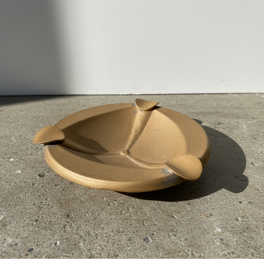 Art Deco copper ashtray featuring bold geometric lines and intricate detailing, a vintage 1920s-inspired piece combining function with timeless sophistication — Hommes and Gardens, Smoke + Fire Collection, Home Decor, Outdoor Decorations, Landscape Architect, Interior Designer, Outdoor Living, Home Design, Luxury Design, Art, Furniture, Objects, Best Gifts, Nature, Backyard, Yard.