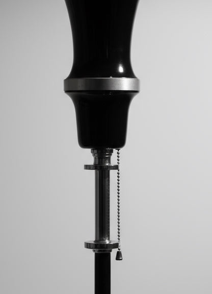 Close-up of RMC Model 795 Art Deco floor lamp showing tiered aluminum shade with black enamel and chrome accents — Hommes and Gardens, Home Decor Collection, Lighting, landscape design, plant design, Landscape Architect, Interior Designer, Outdoor Living, Outdoor Decorations, Home Design, Luxury Design, Art, Furniture, Objects, Best Gifts, Nature, Backyard, Yard.