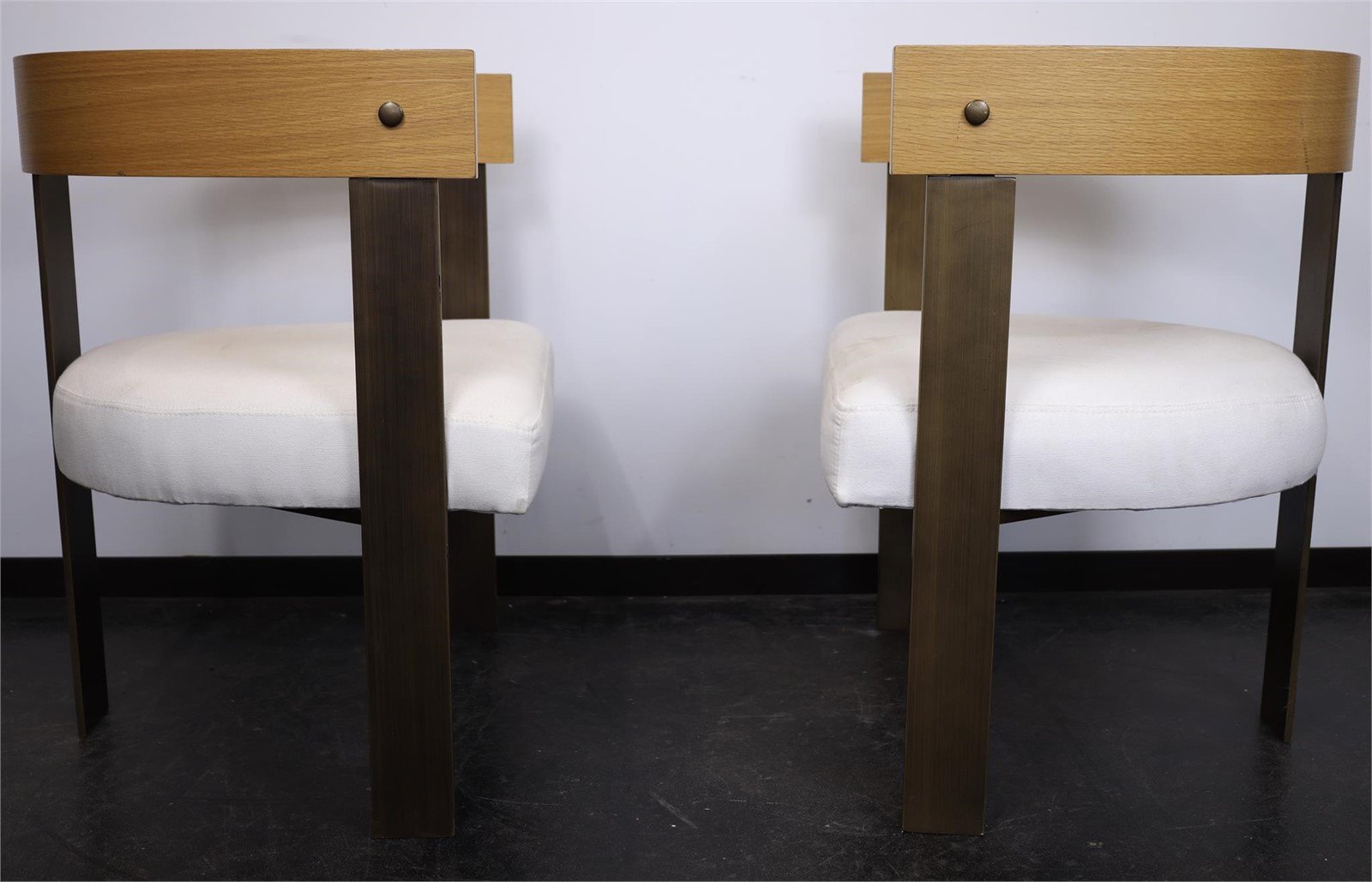 Set of four Mid-Century Modern/Art Deco Style Dining Chairs featuring wooden backrests and white upholstery. hommes + gardens estudio.