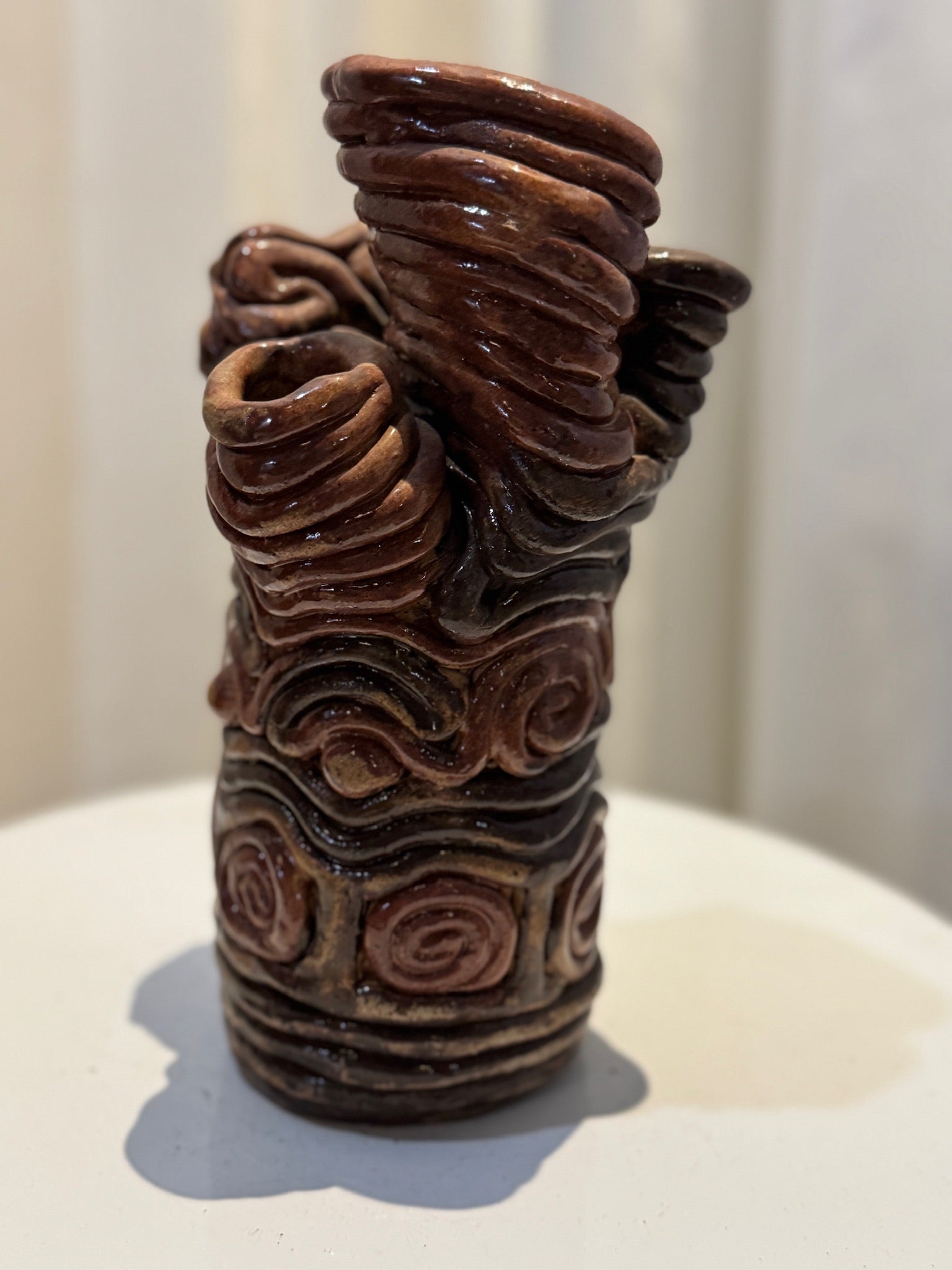Artist-signed clay swirl ceramic vase, handmade with flowing sculptural design and rich brown-black glaze, embodying organic modern artistry — Hommes and Gardens, Vases + Vessels Collection, Landscape Architect, Interior Designer, Outdoor Living, Art, Furniture, Objects, Best Gifts, Nature, Backyard, Yard, Outdoor Decorations, Home Decor, Home Design, Luxury Design.