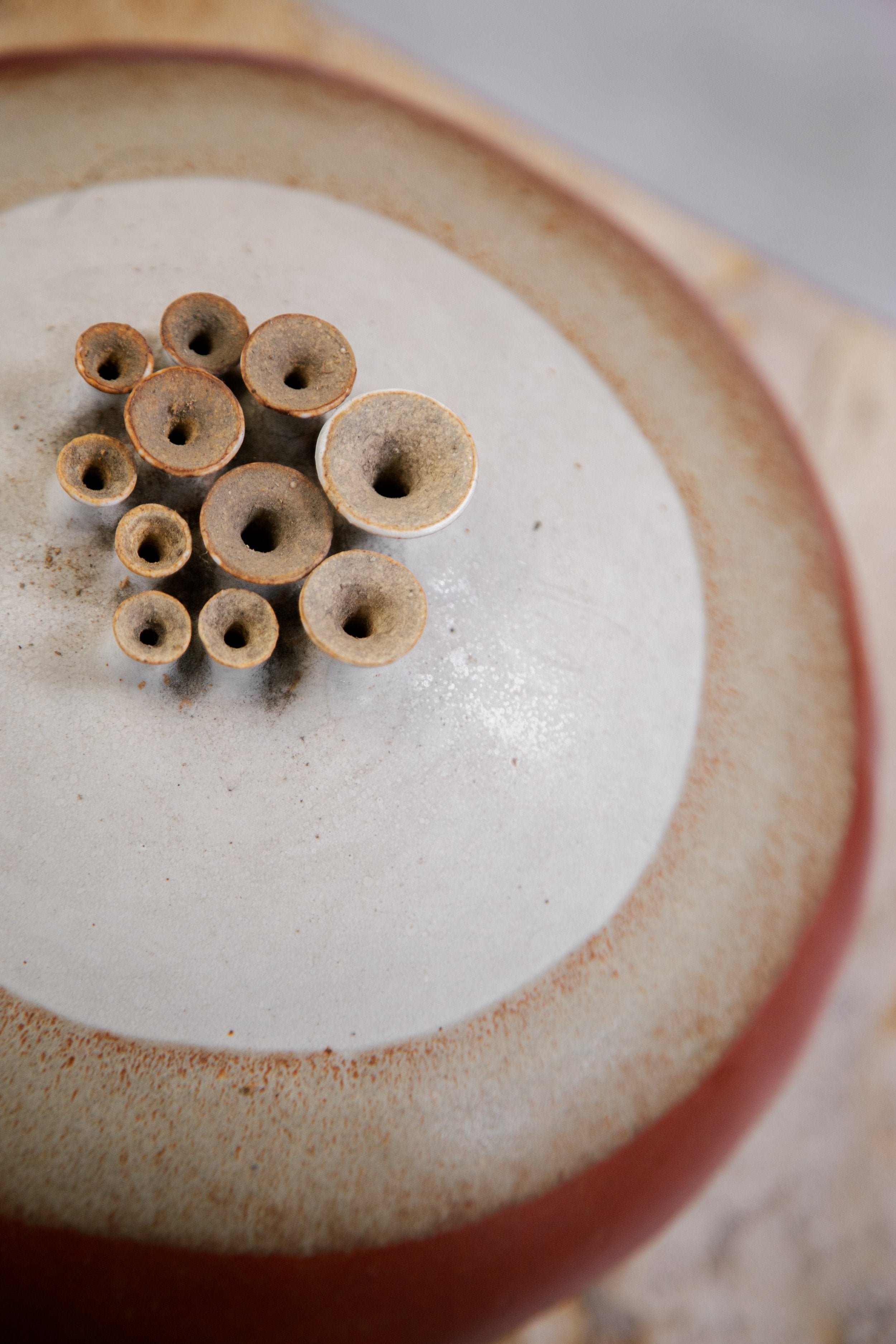 Artistic ceramic weedpot featuring multiple holes and signed craftsmanship, an expressive mid-century pottery accent — Hommes and Gardens, Objects, Pots + Planters Collection, home decor, outdoor decorations, home design, luxury design, Landscape Architect, Interior Designer, Outdoor Living, Art, Furniture, Objects, Best Gifts, Nature, Backyard, Yard.