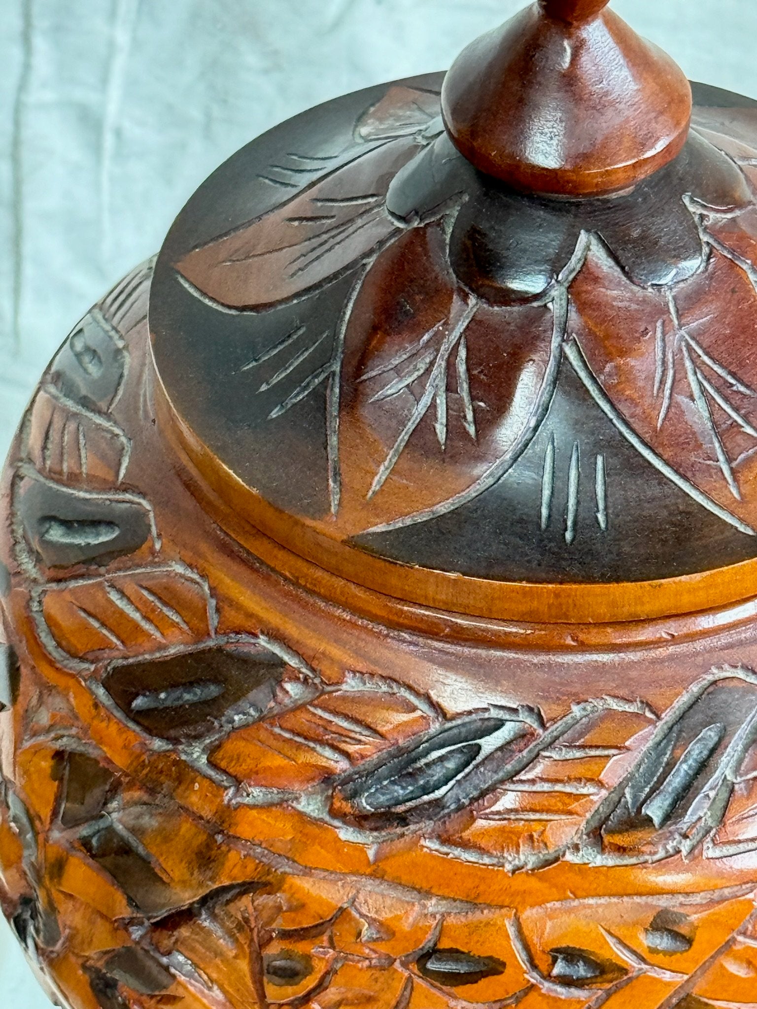 Close-up of Vintage Arts and Crafts Hand Carved Wooden Lidded Vessel showcasing intricate details and craftsmanship. hommes + gardens estudio