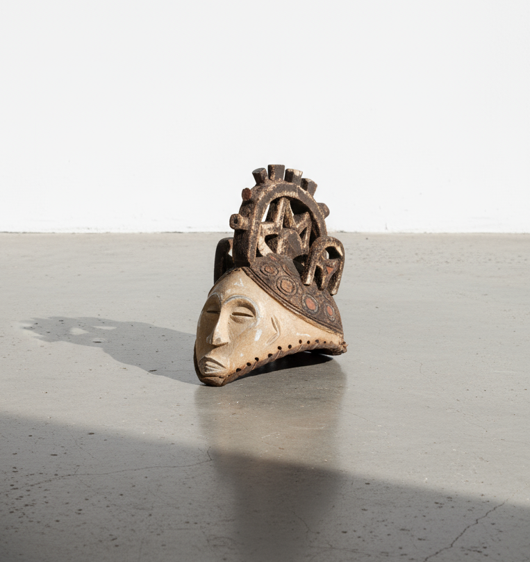 Authentic 19th-century Nigerian Igbo mask crafted from wood and adorned with dyed fabric and wicker, showcasing traditional carvings and cultural symbolism — Hommes and Gardens, Home Decor Collection, Outdoor Decorations, Landscape Architect, Interior Designer, Outdoor Living, Home Design, Luxury Design, Art, Furniture, Objects, Best Gifts, Nature, Backyard, Yard.