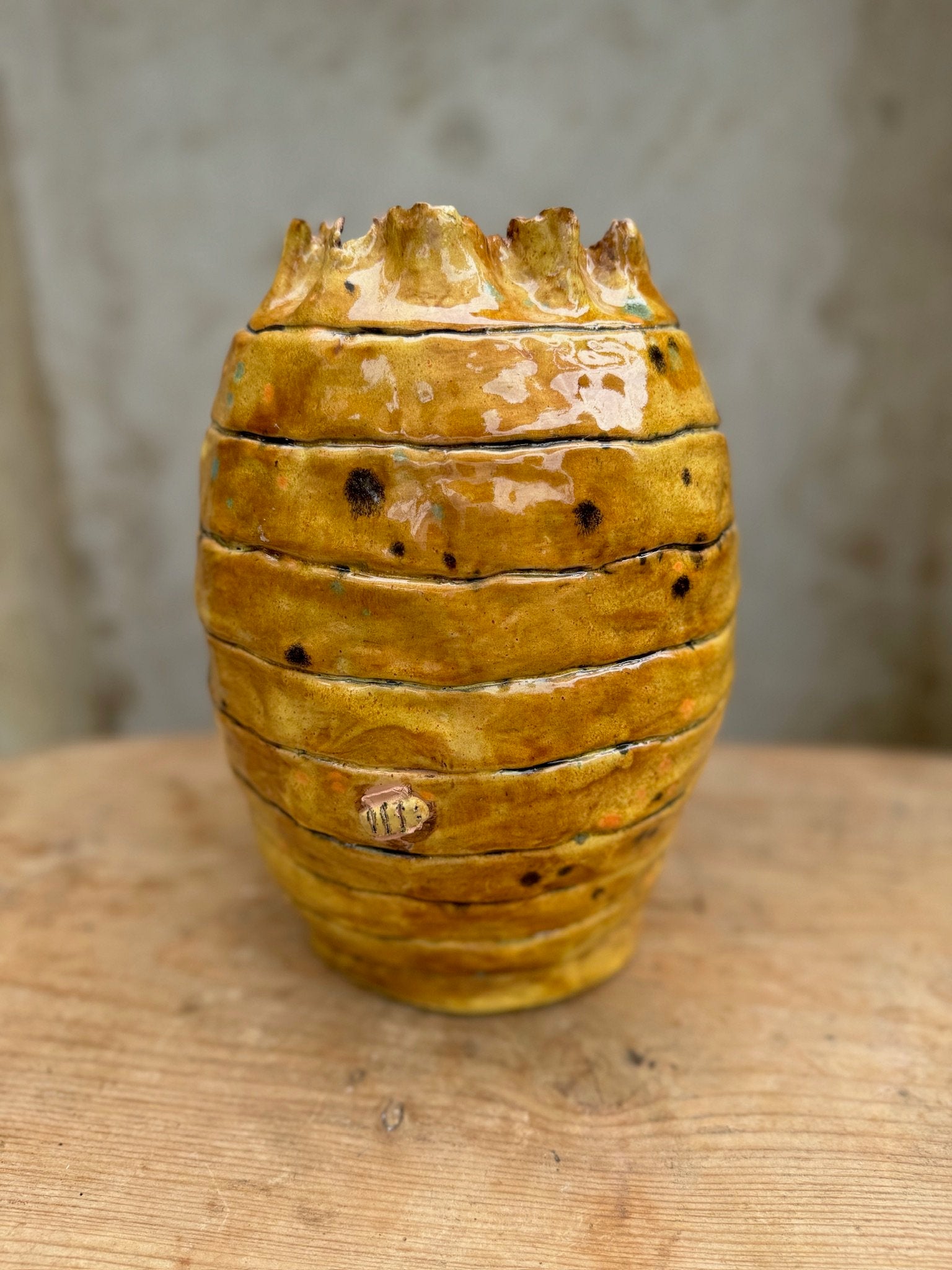 Bee hive ceramic jar or vase with hand-painted bees and textured layers, a charming rustic pottery piece for home décor — Hommes and Gardens, Vases + Vessels, Kitchen Collection, home decor, outdoor decorations, home design, luxury design, Landscape Architect, Interior Designer, Outdoor Living, Art, Furniture, Objects, Best Gifts, Nature, Backyard, Yard.