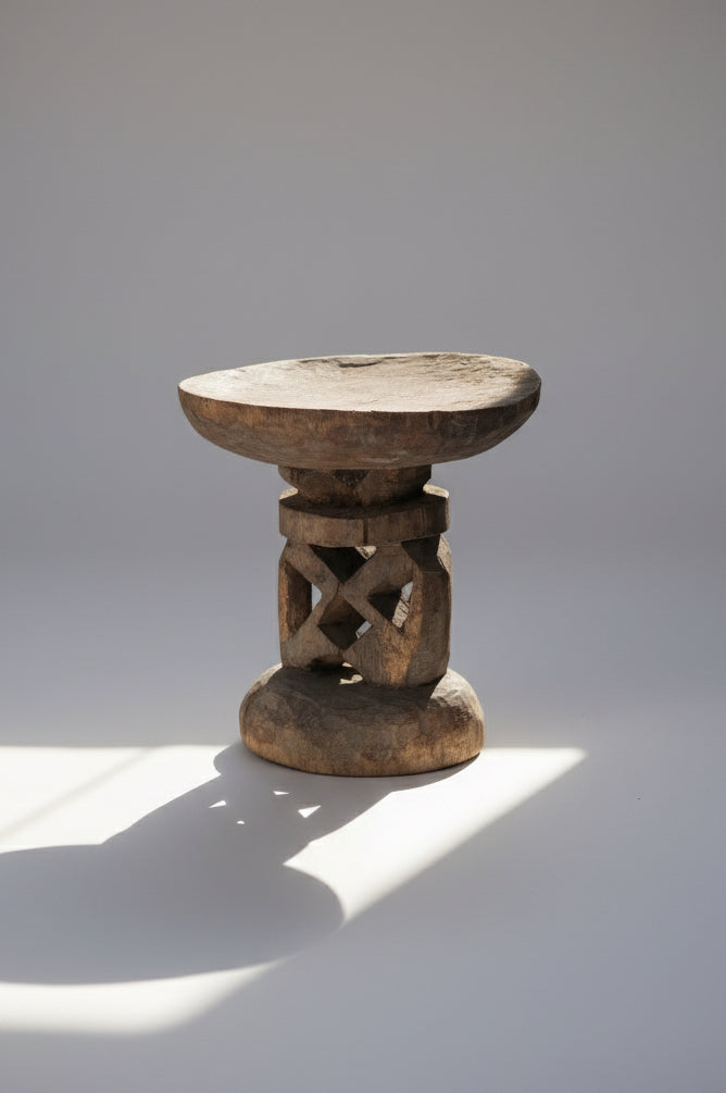Carved primitive style wooden stool from the Shona people of Zimbabwe, featuring openwork central pillar and rustic craftsmanship, a unique cultural furniture piece — Hommes and Gardens, Furniture Collection, Home Decor, Outdoor Decorations, Landscape Architect, Interior Designer, Outdoor Living, Home Design, Luxury Design, Art, Furniture, Objects, Best Gifts, Nature, Backyard, Yard.