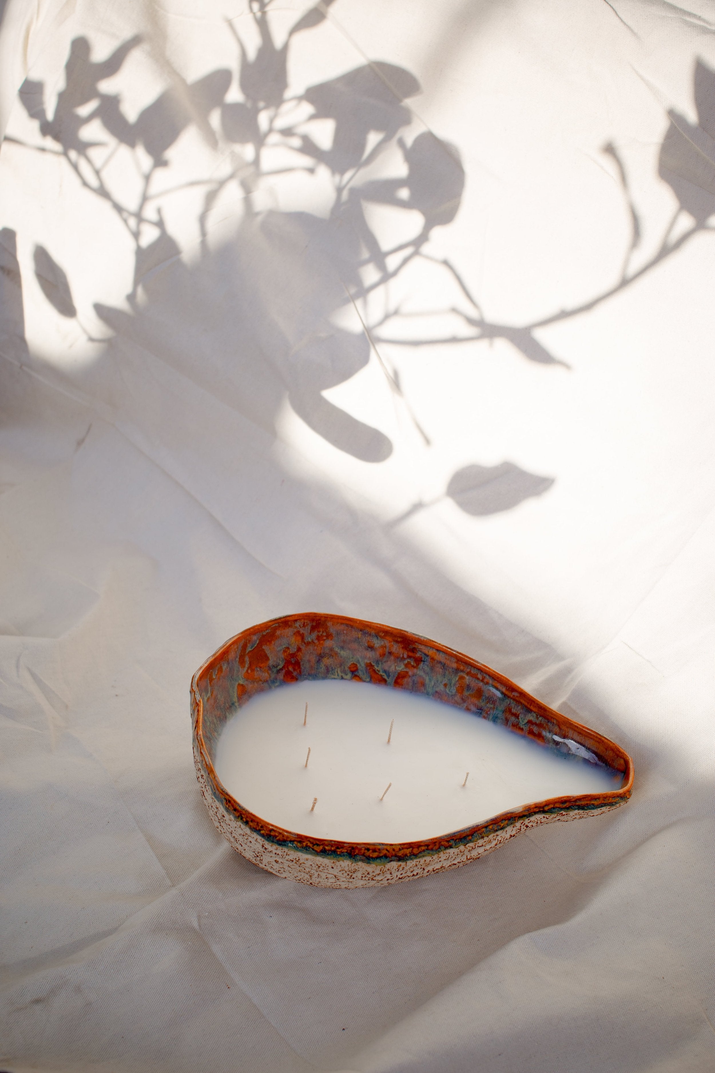 Handmade Ceramic Glazed Bowl | H&G x Western Disco with candle, showcasing unique design and natural light effects. hommes + gardens estudio