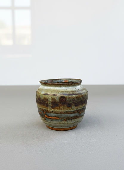 Studio pottery ceramic urn vase signed P.S.E. featuring brown, gray, and terracotta ash glaze with natural textured finish — Hommes and Gardens, Home Decor Collection, landscape design, plant design, Landscape Architect, Interior Designer, Outdoor Living, Outdoor Decorations, Home Design, Luxury Design, Art, Furniture, Objects, Best Gifts, Nature, Backyard, Yard.
