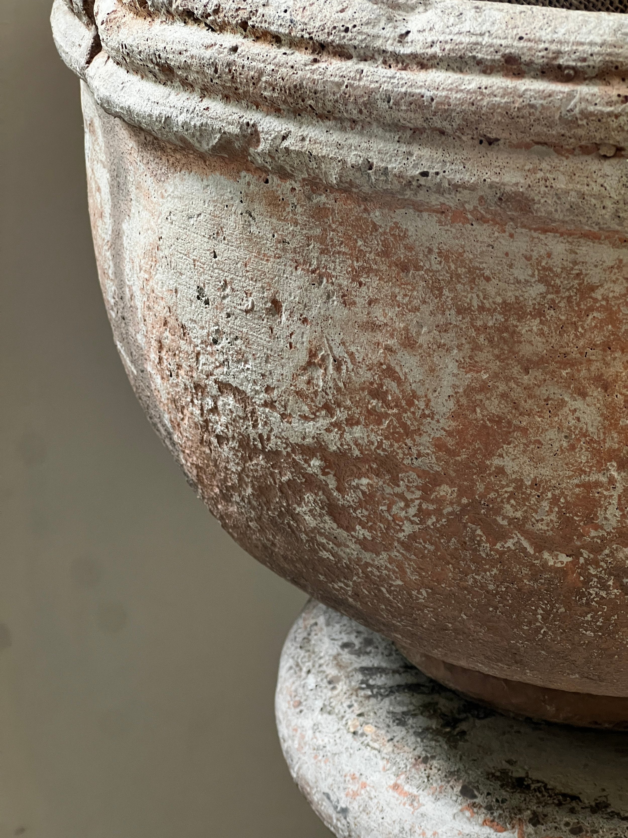 Close-up of Vintage Sevilla Stone Planter w/ Pedestal showcasing its detailed texture and elegant design. hommes + gardens estudio.