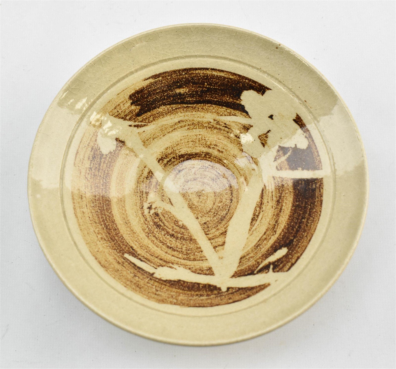 Crackle glaze pottery dinner plate in beige and brown tones, signed by the artist, featuring unique textured surface and rustic charm — Hommes and Gardens, home decor, outdoor decorations, home design, luxury design, Landscape Architect, Interior Designer, Outdoor Living, Art, Furniture, Objects, Best Gifts, Nature, Backyard, Yard.