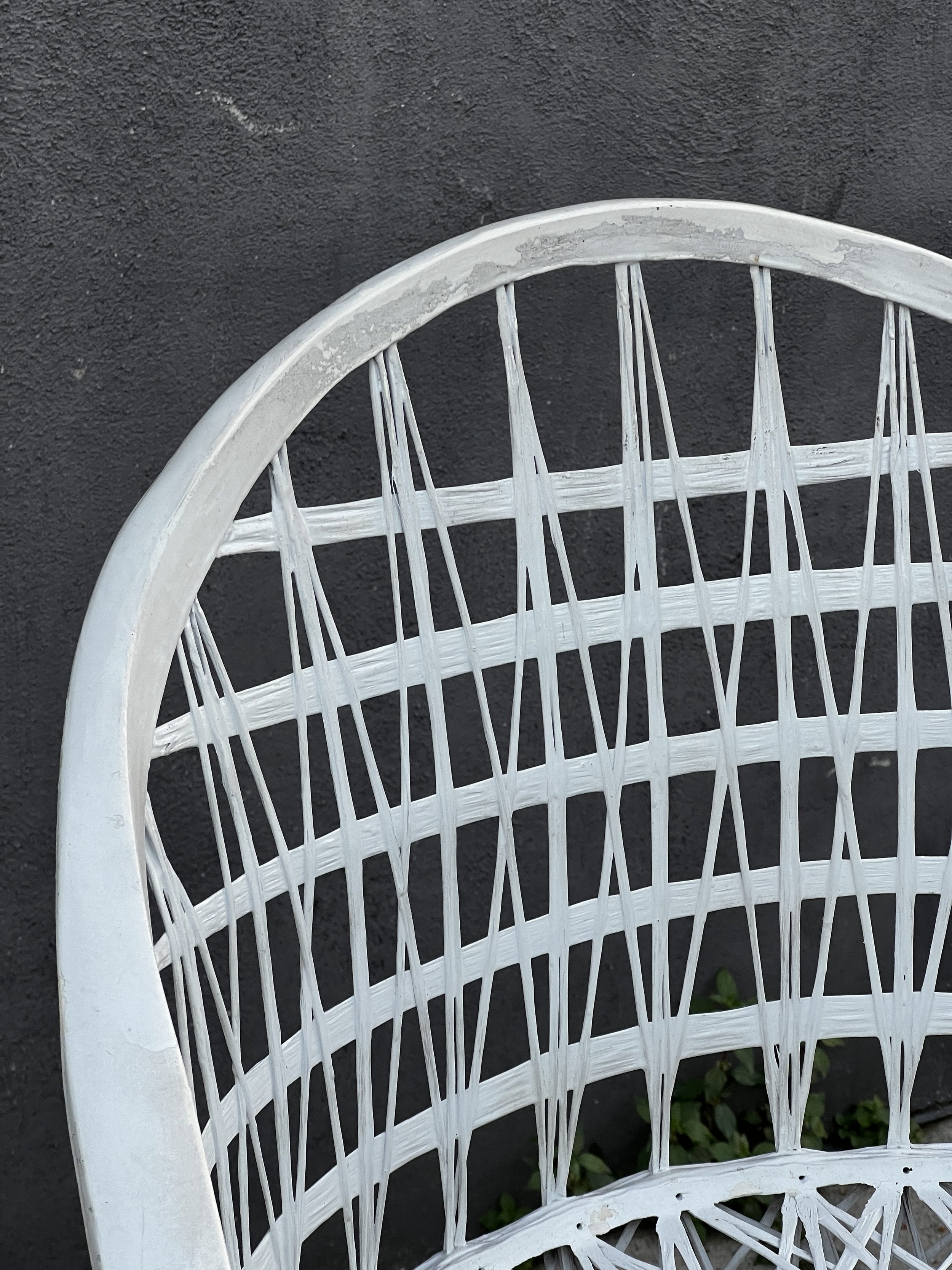 Close-up of the stylish woven back of a Pair of Russell Woodard Spun Fiberglass Bar Stools, designed for elegance. hommes + gardens estudio.